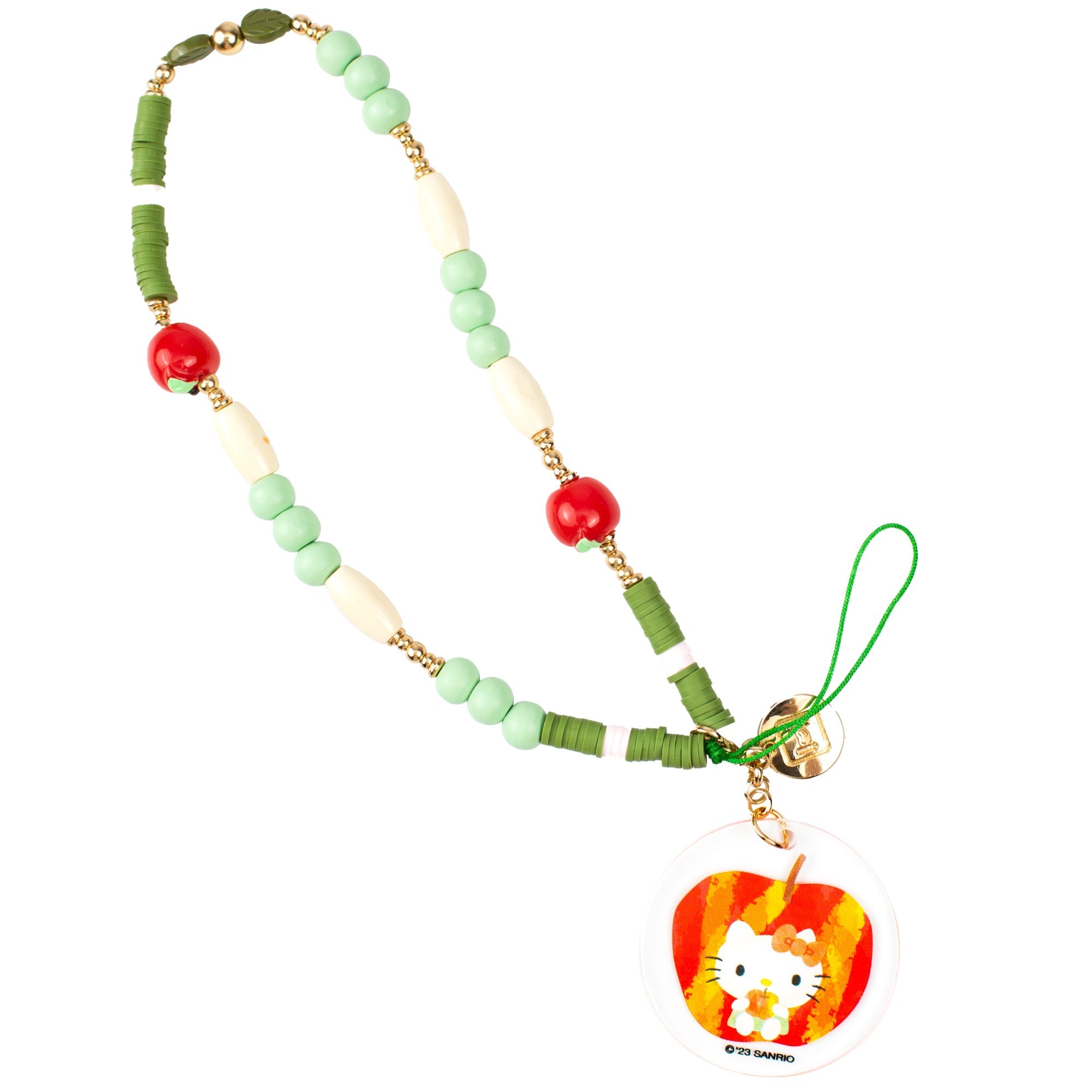 Close-up of phone wrist strap with apple beads and Hello Kitty charm on denim background.