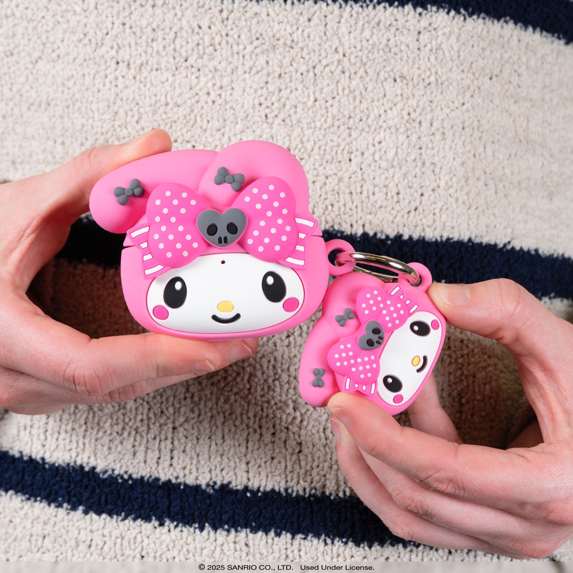 Kuromi AirTag case attached to a pet collar
