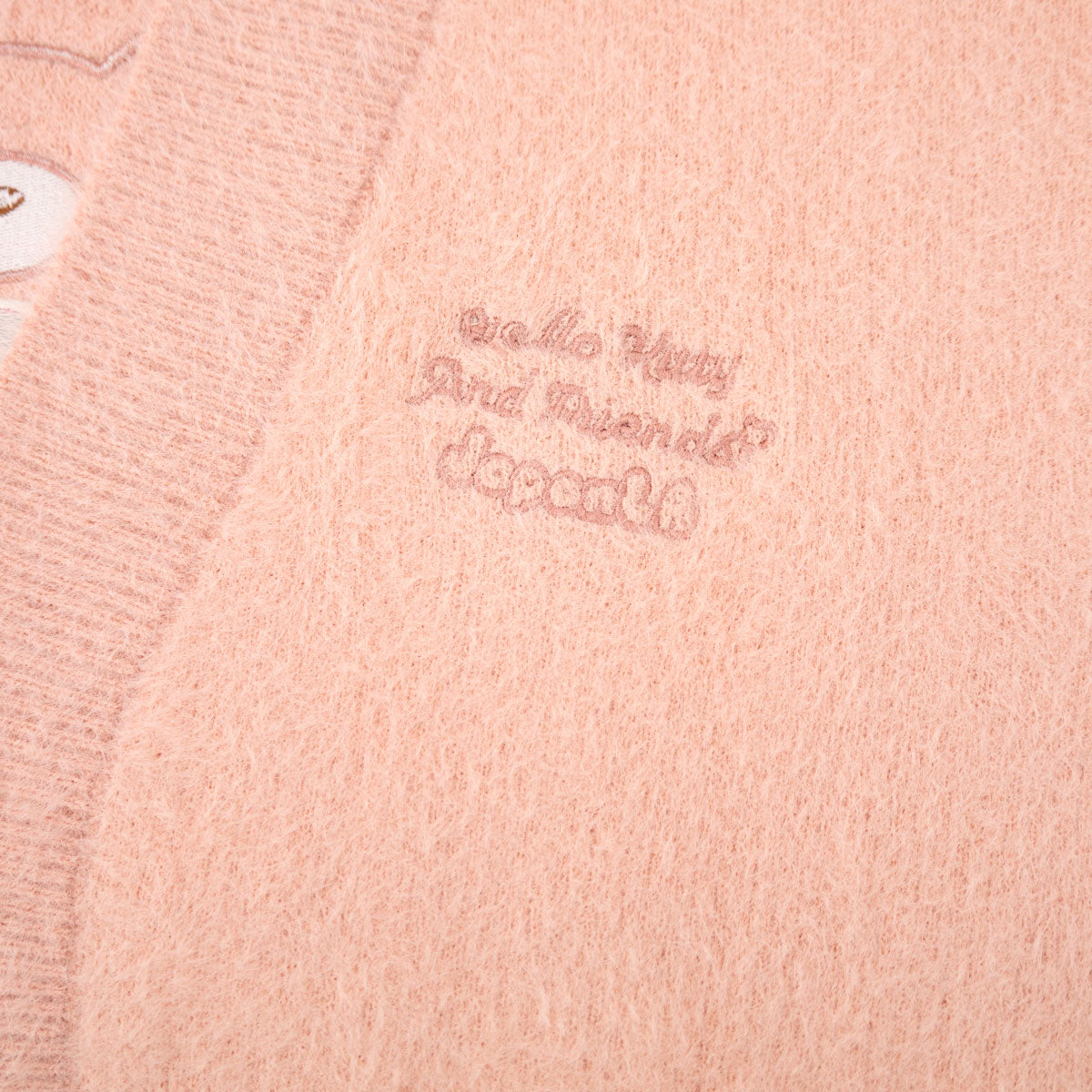 Back detail of the kawaii cardigan showcasing My Melody and plush design elements