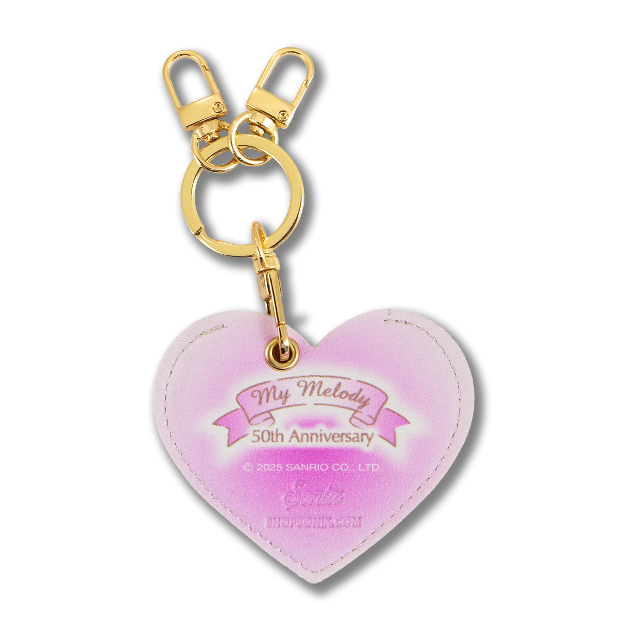 AirTag holder keychain displayed with keys and luggage for travel.