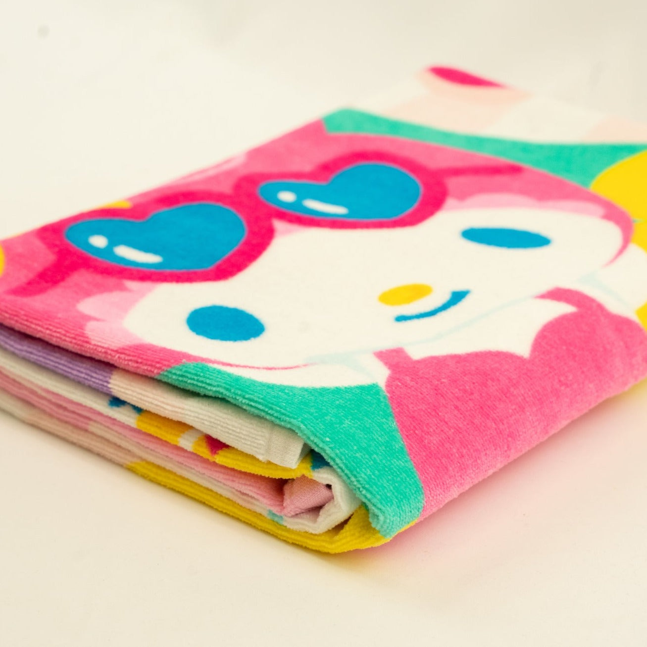 Cozy Hello Kitty towel laid out by the poolside