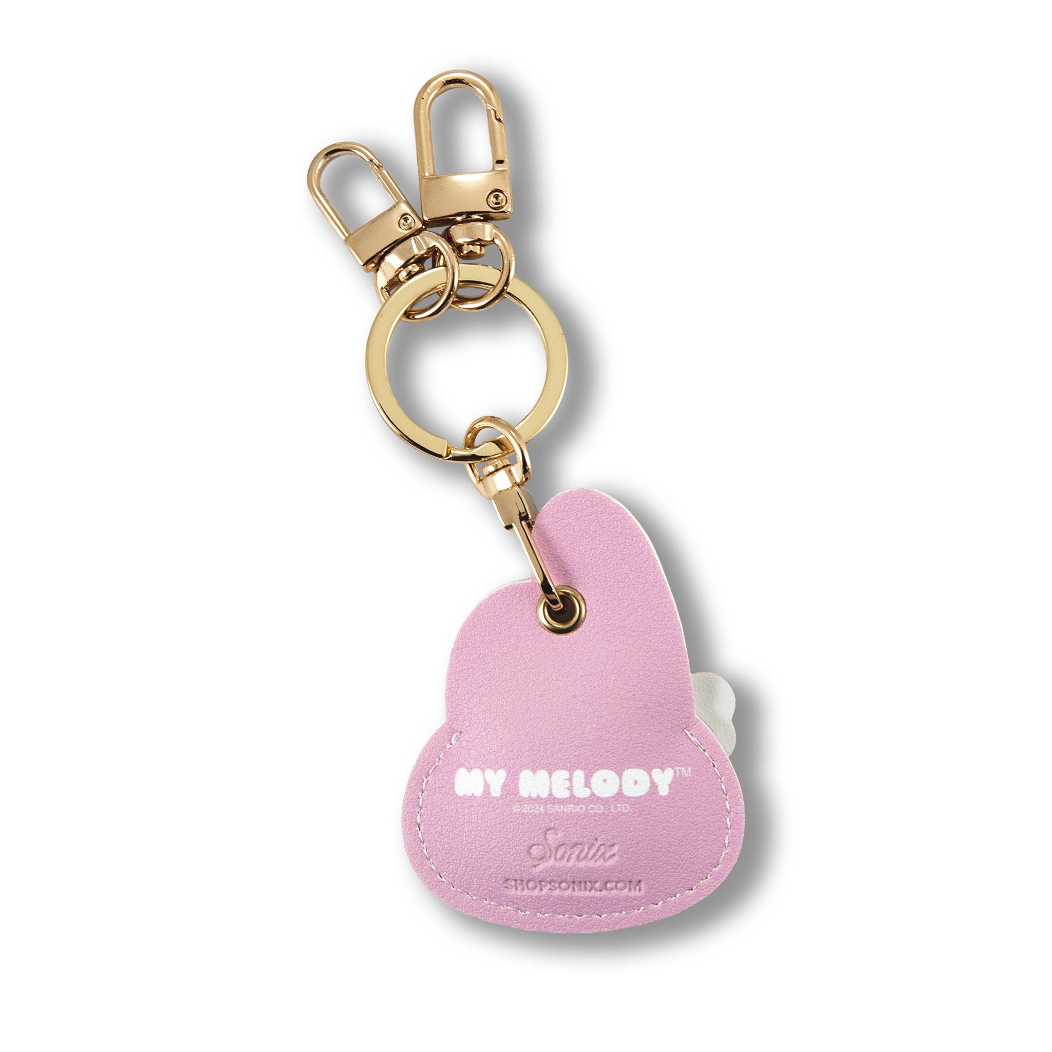 Sonix AirTag case inside the keychain’s hidden pocket, gold carabiner detail