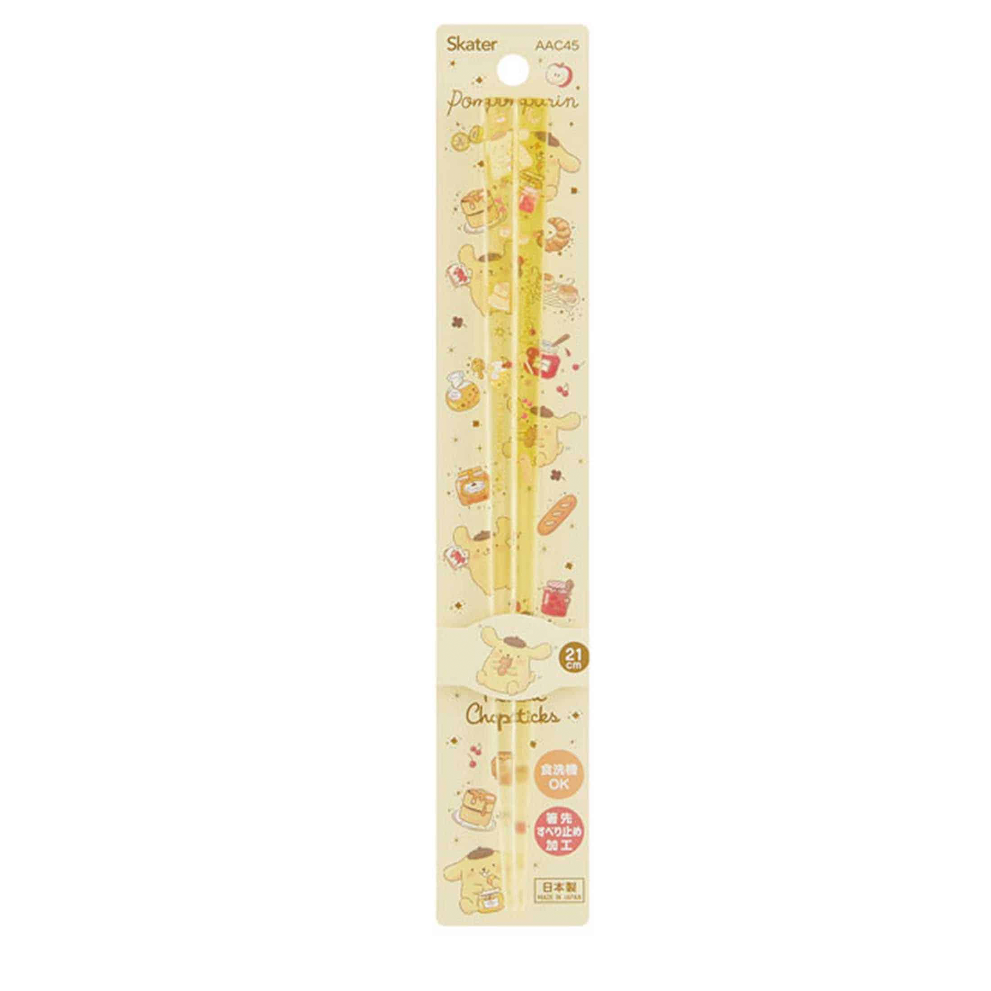 Close-up of Pompompurin design on golden acrylic chopsticks