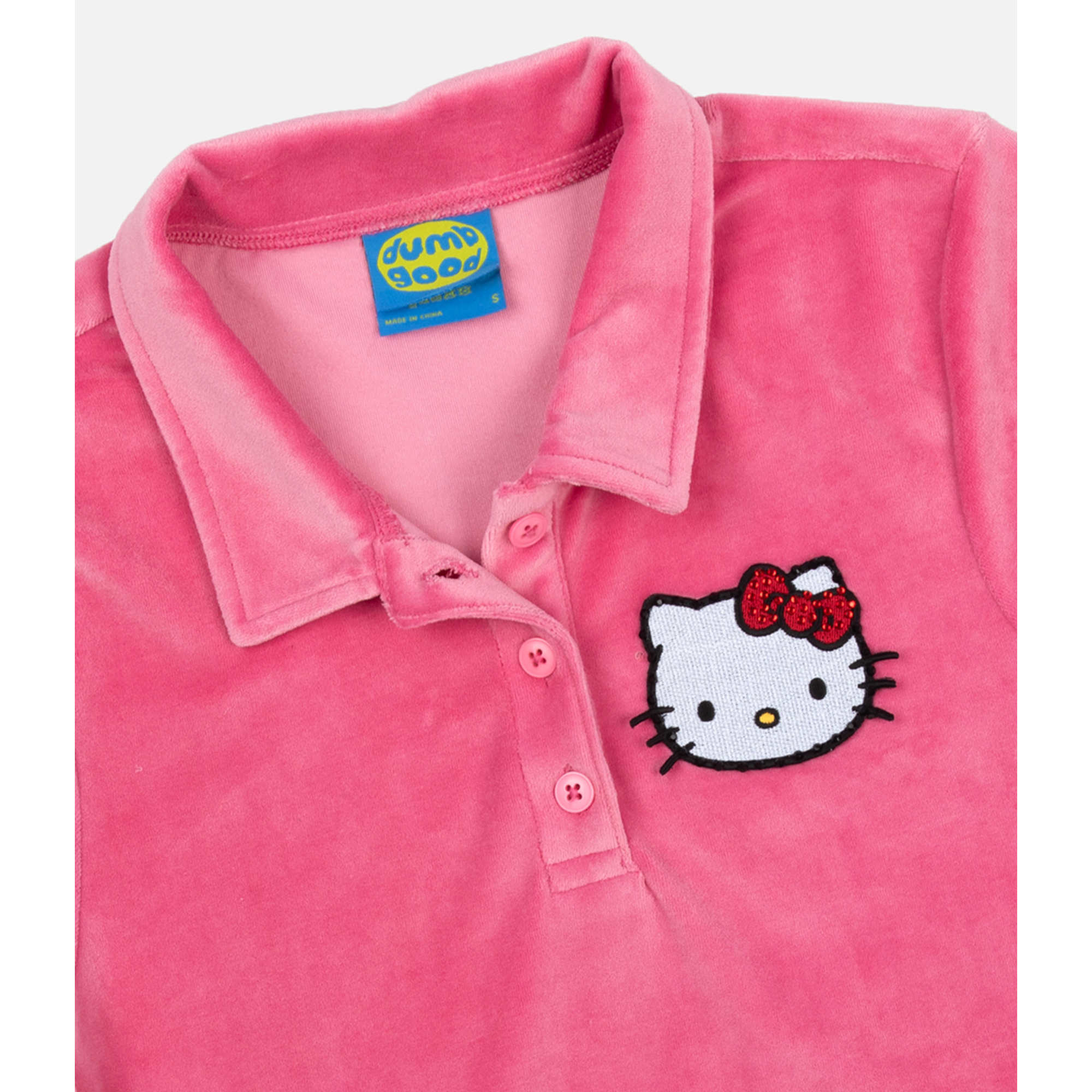 Front view of the Hello Kitty cropped polo shirt in pink velour.