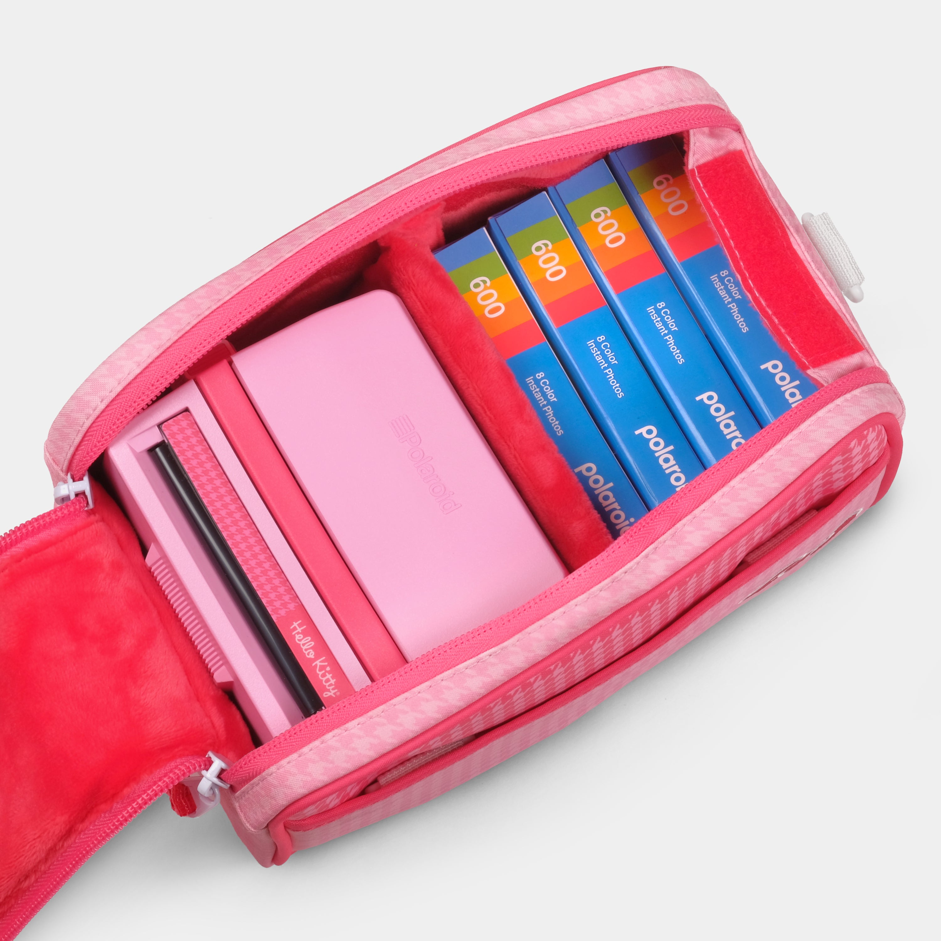Front pocket open to reveal film storage in Hello Kitty bag