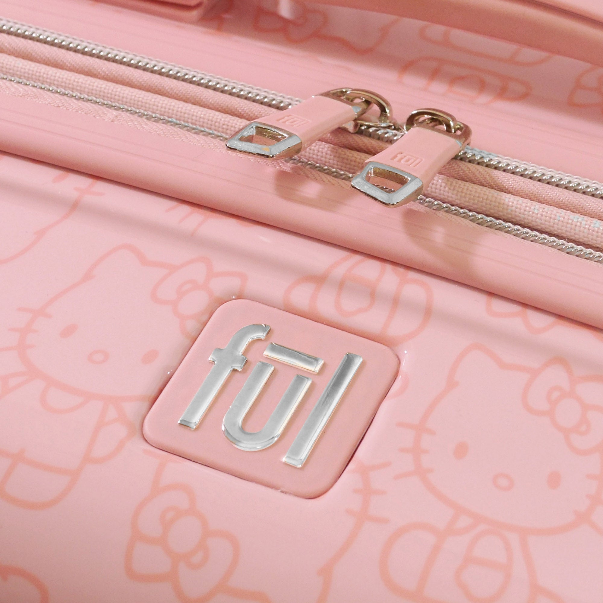 Side view of the expandable pink suitcase set.