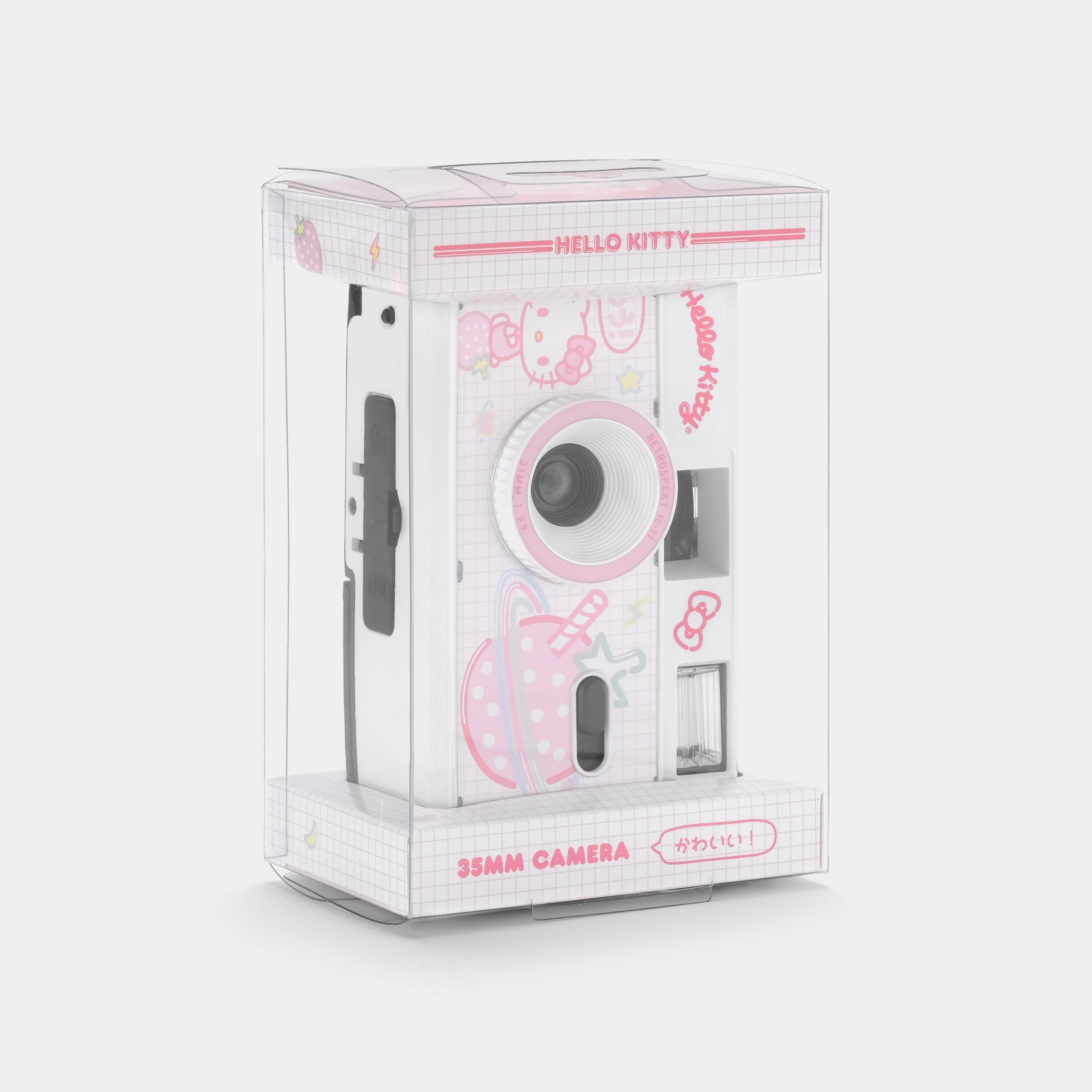 User holding the Hello Kitty Strawberry Planet camera outdoors