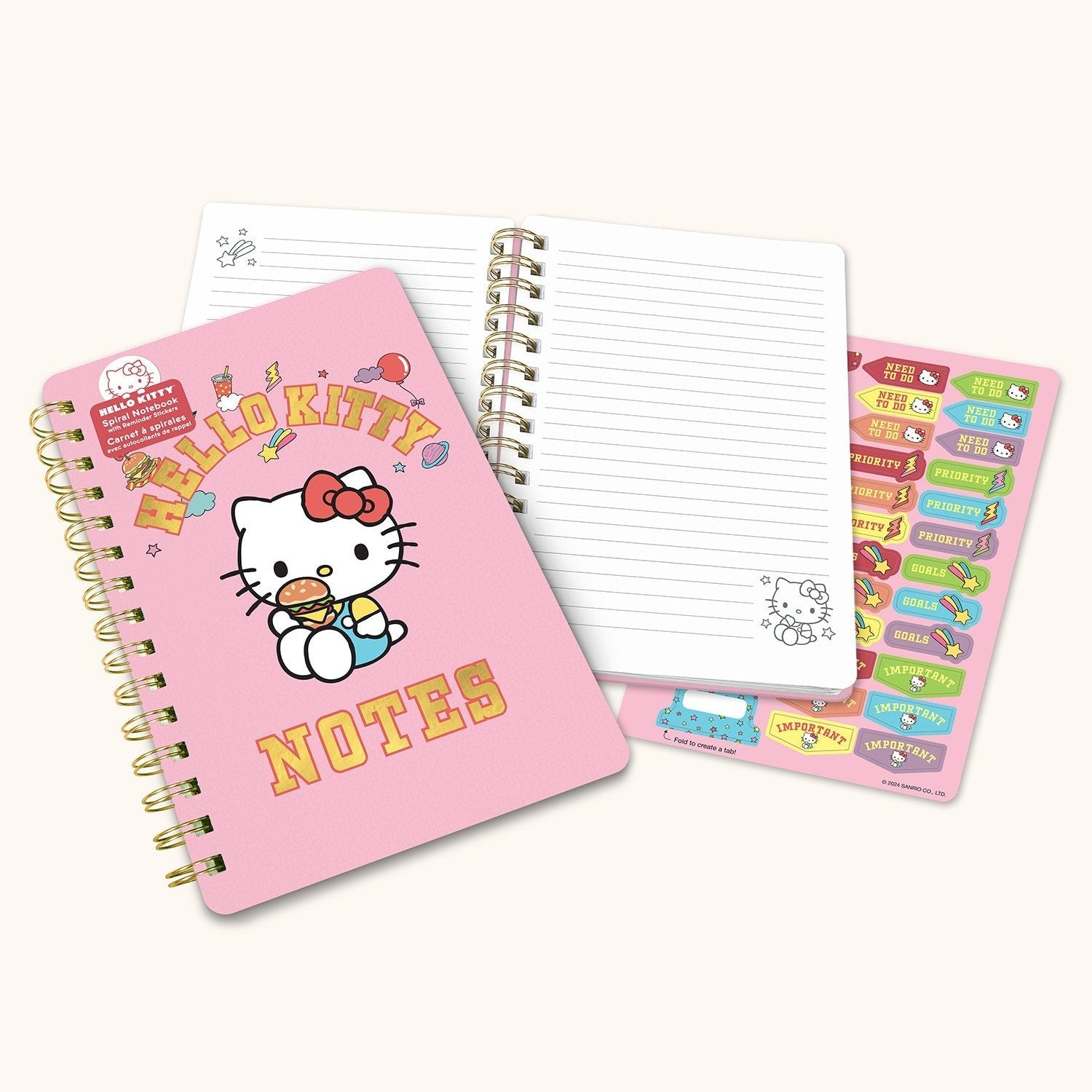 Close-up of the notebooks foil-detailed cover with Hello Kitty artwork.