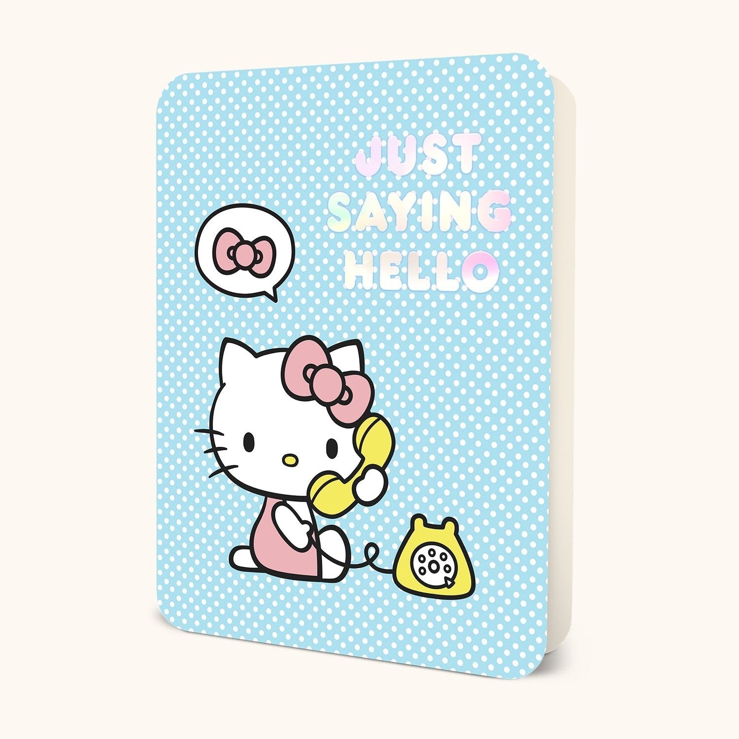 Close-up of Hello Kitty birthday card with gold foil detailing
