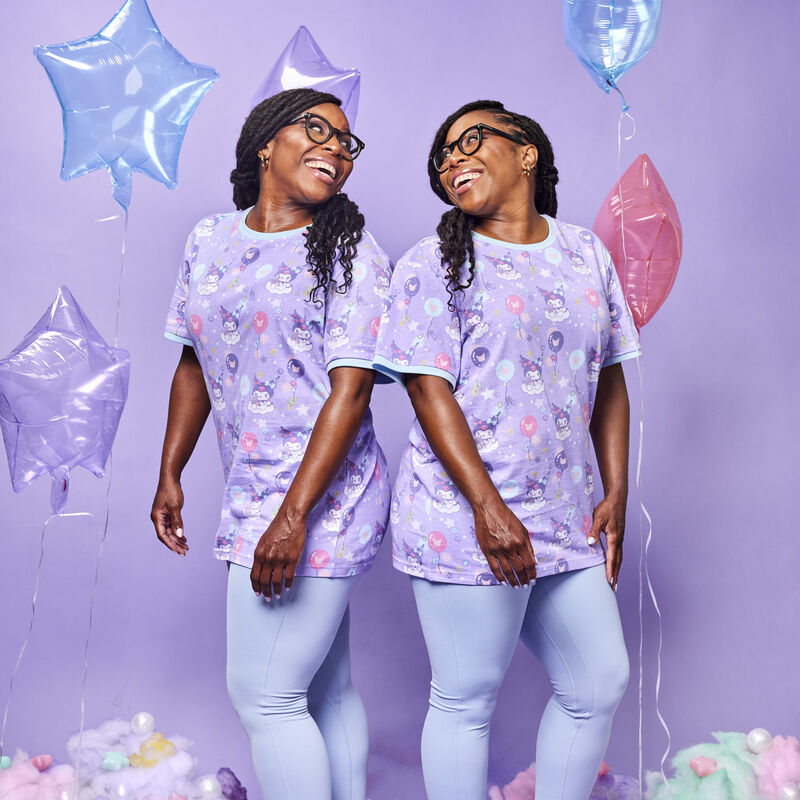 Close-up of Kuromi and Baku floating on clouds in the carnival-themed tee.