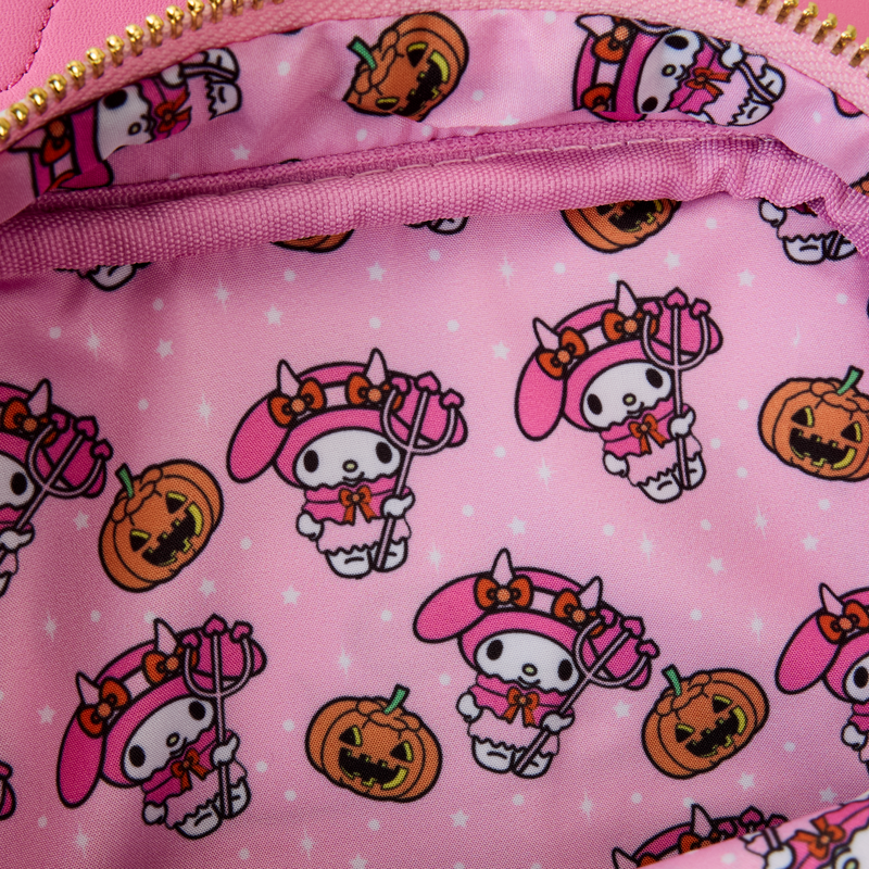Close-up of reversible coin purse showing Flat and My Sweet Piano characters