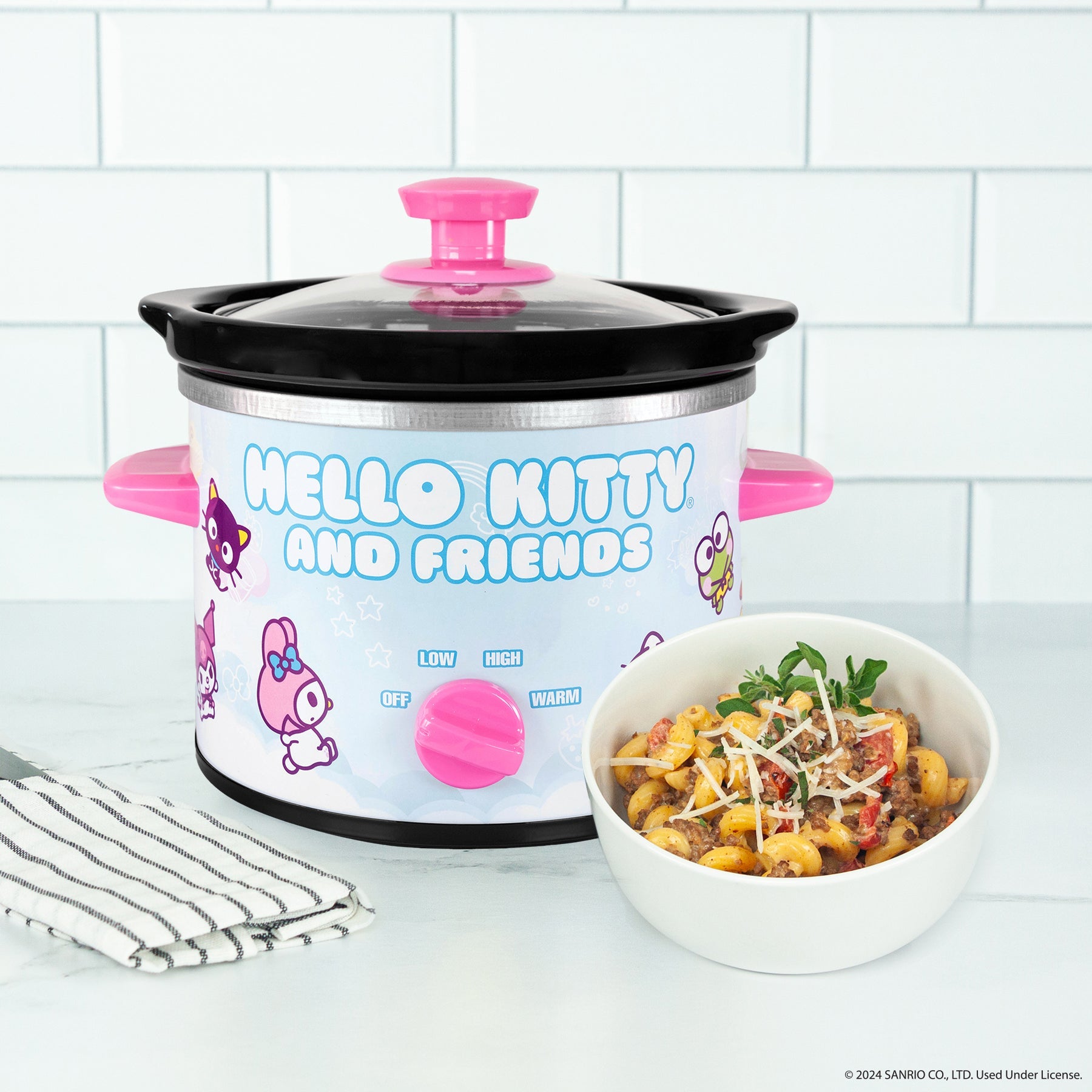 Cute Hello Kitty kitchen accessories displayed with the slow cooker