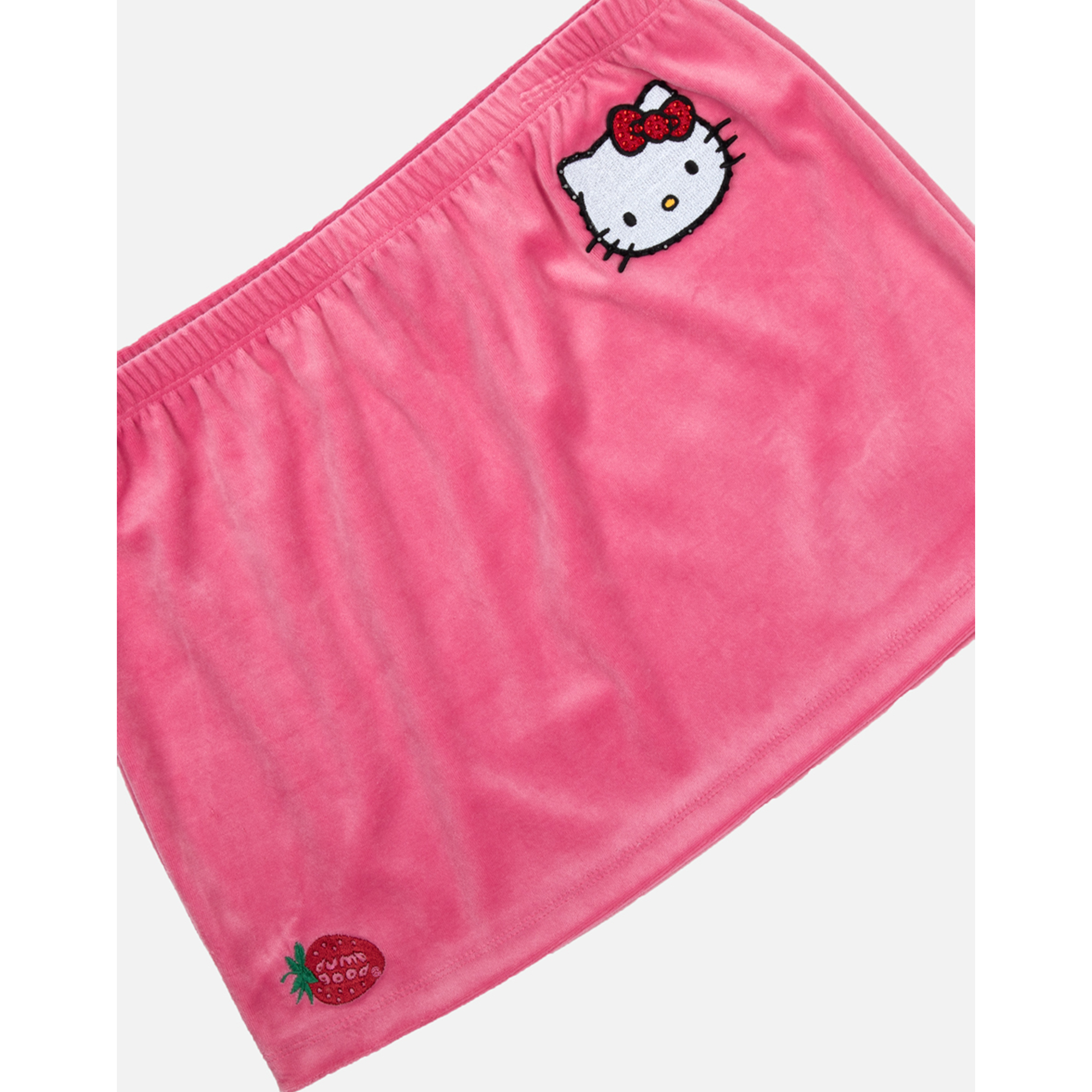 Flat lay of the velour mini skirt showcasing its retro-inspired design