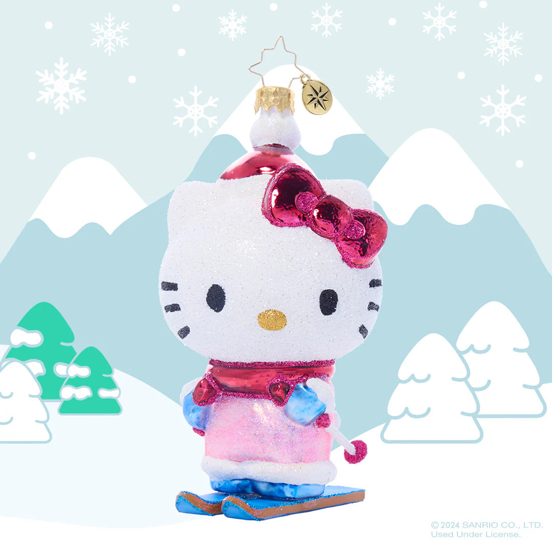Hello Kitty glass ornament on a Christmas tree, surrounded by other ornaments