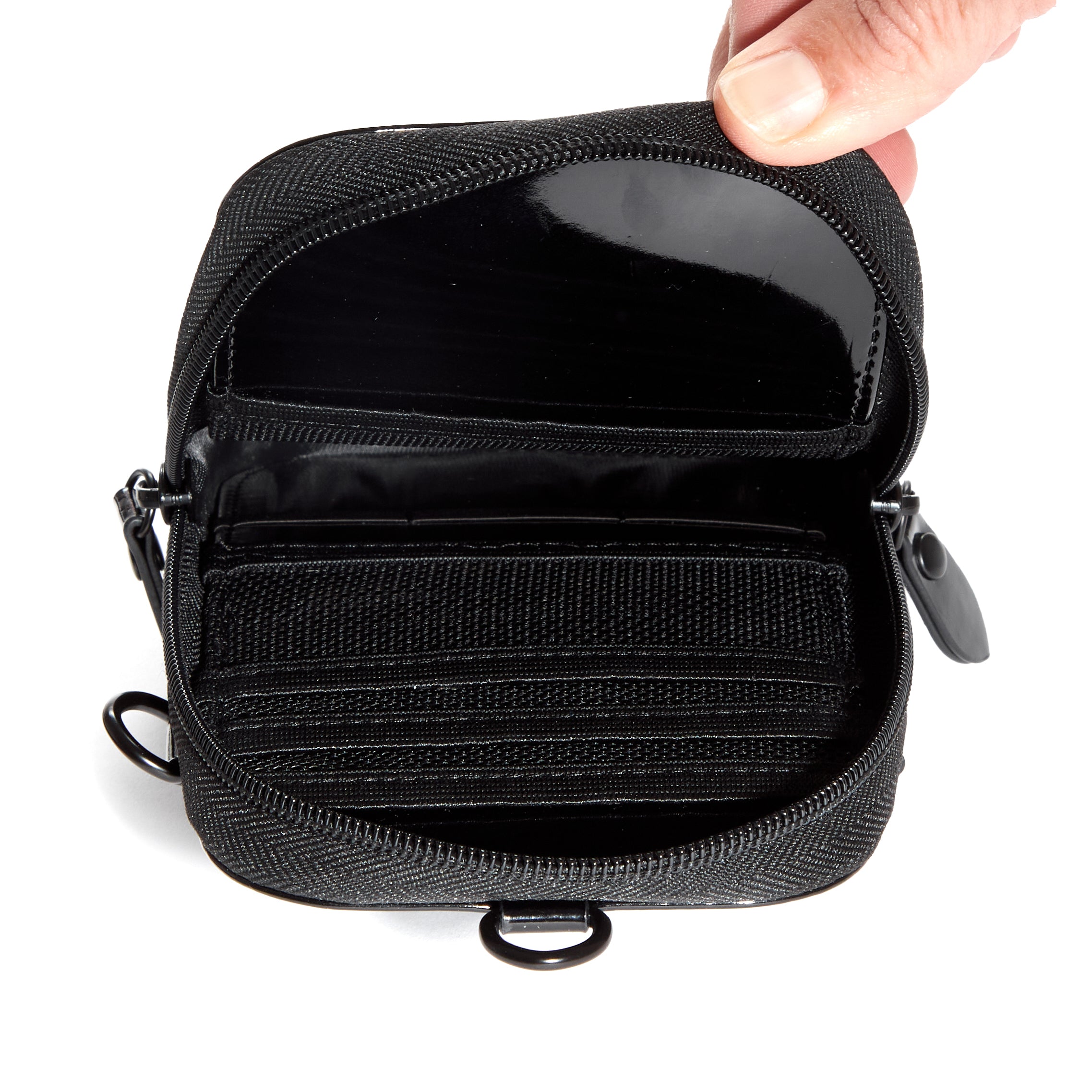 Versatile 3-in-1 Hello Kitty phone pouch worn as a crossbody or wristlet during outdoor outing