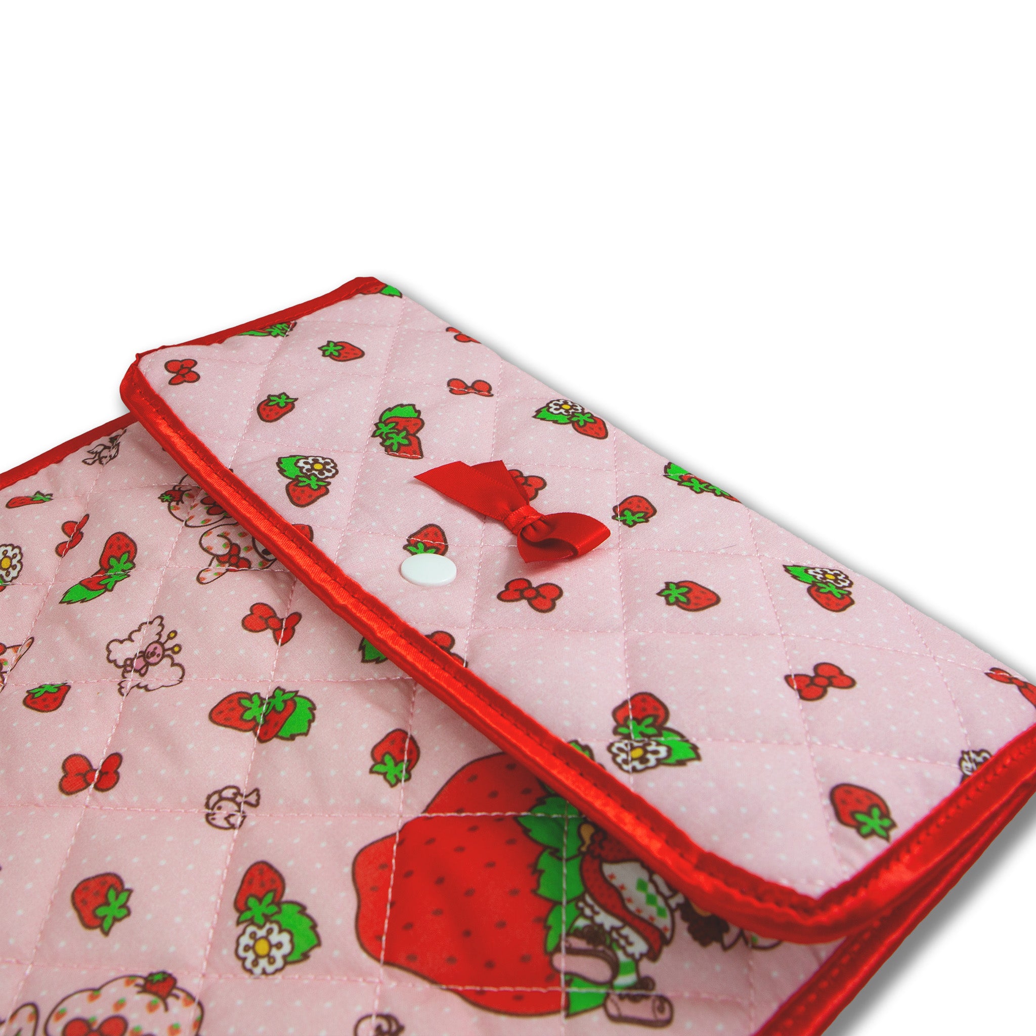 Close-up of the quilted laptop sleeve featuring My Melody and Strawberry Shortcake.