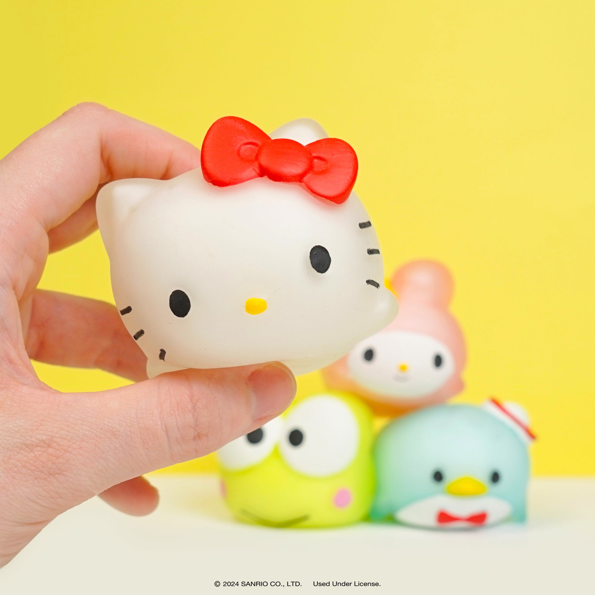 Close-up of soft and stretchy Hello Kitty squishy toy for stress relief.