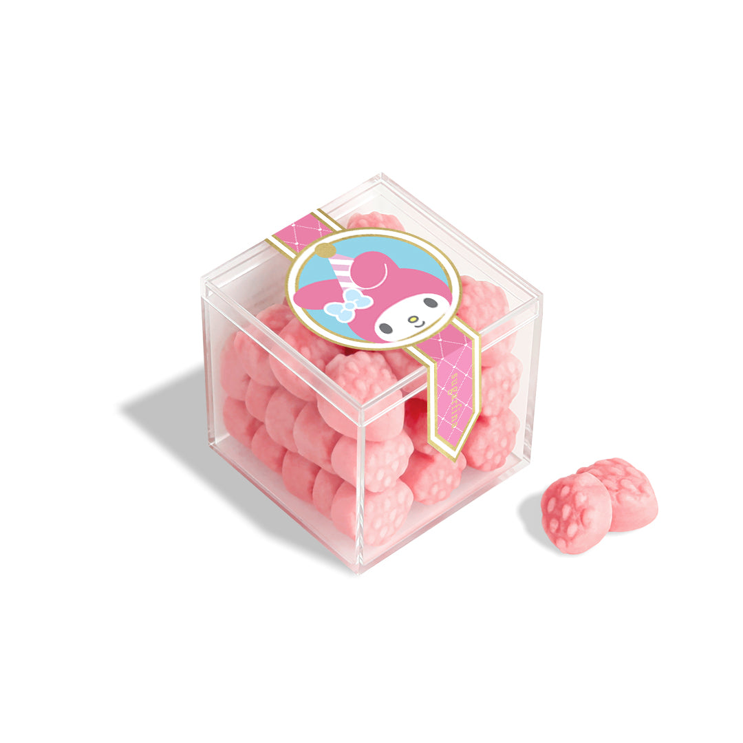 A person gifting My Melody 50th Anniversary strawberry gummies in a clear cube box