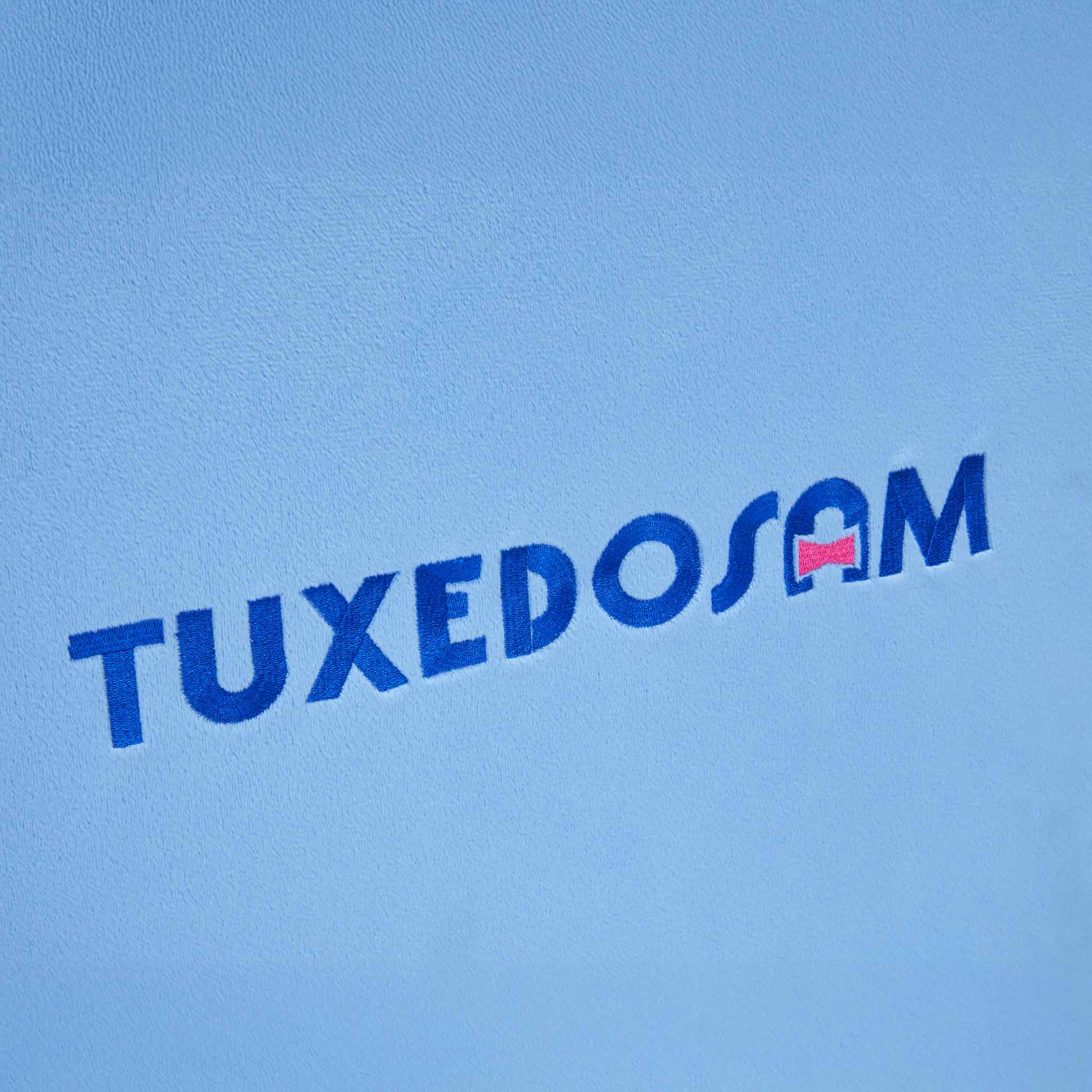 Close-up of Tuxedosams signature sailor hat and bowtie detailing on the chair
