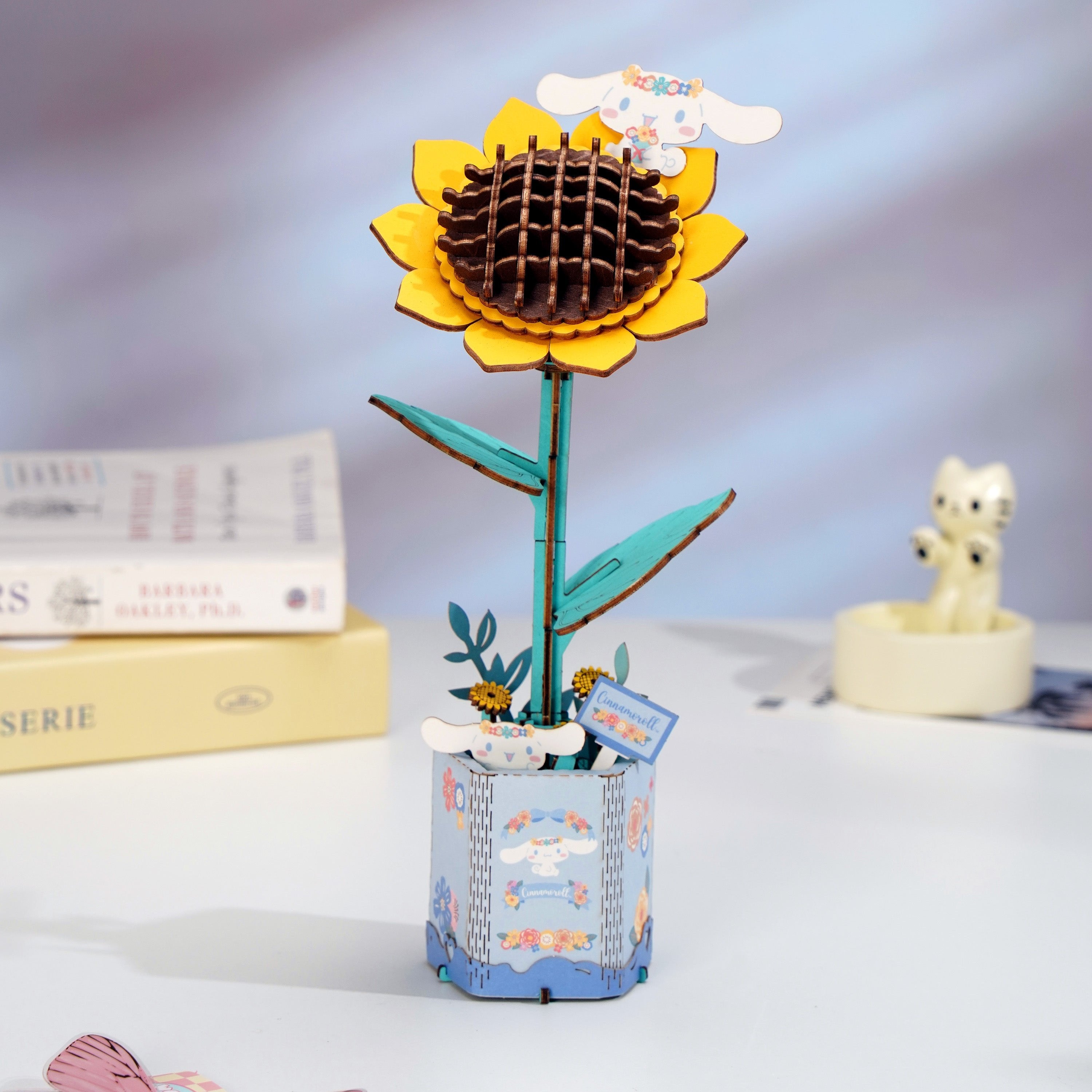 Assembling the Cinnamoroll Sunflower 3D wooden puzzle, showing the wooden pieces and instructions
