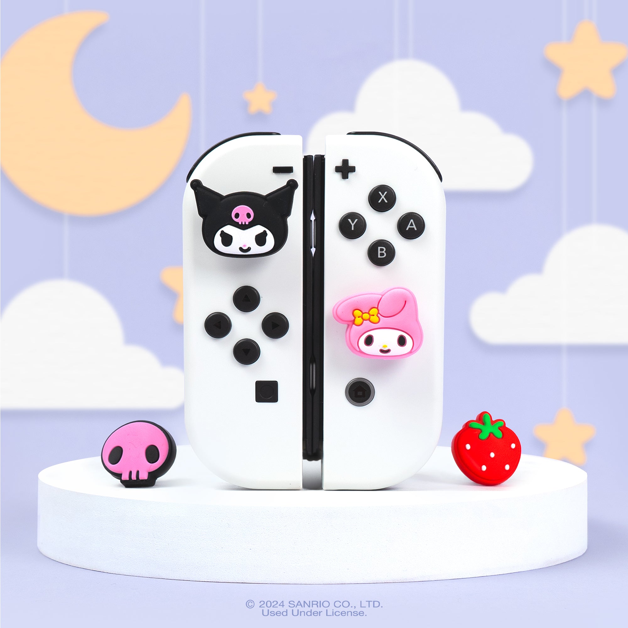 Hello Kitty Kuromi grip cap installed on blue Nintendo Switch Joycon