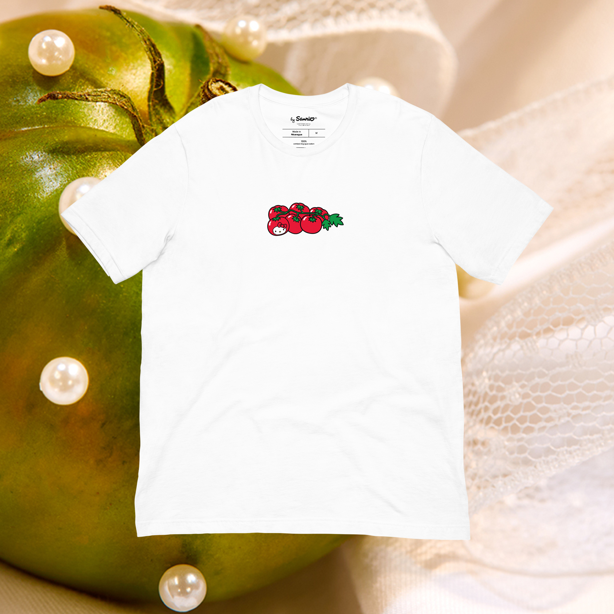 Close-up of Hello Kitty tomato graphic on a summer t-shirt
