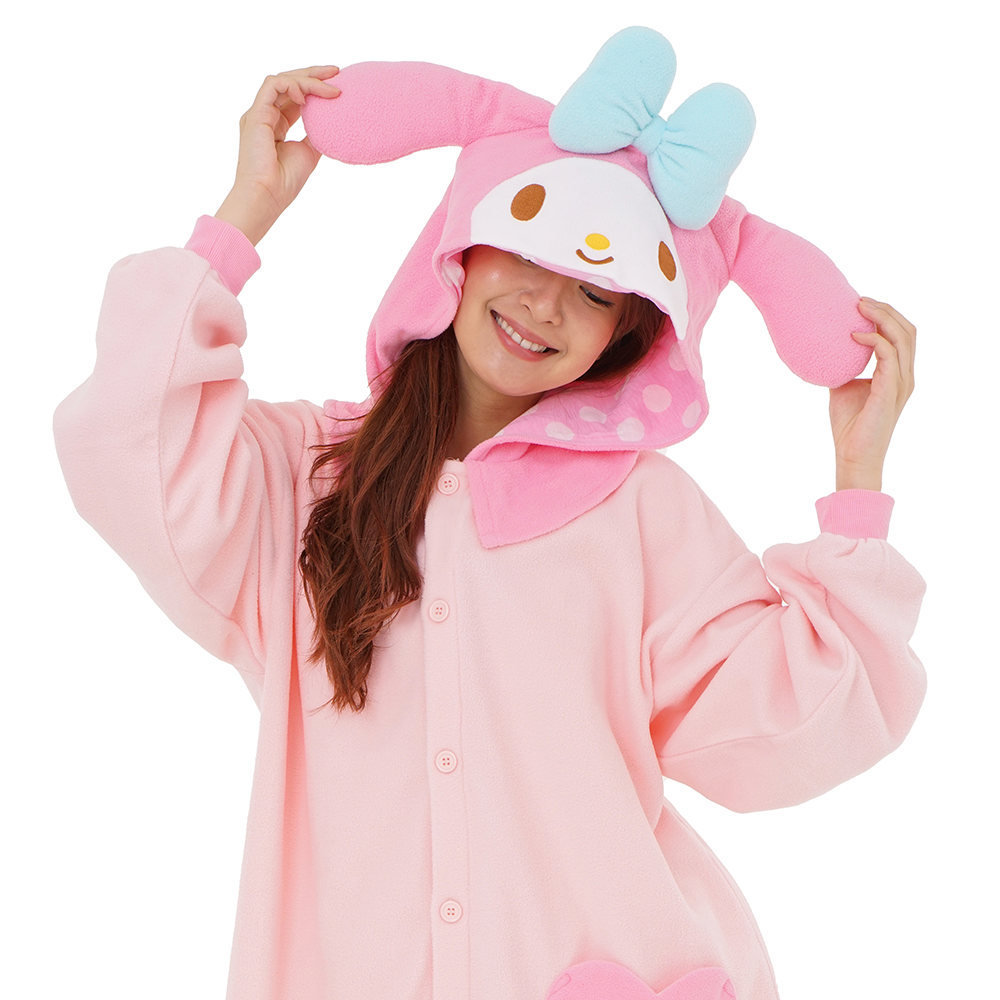 Person lounging in the My Melody kigurumi, highlighting the cozy fit and playful tail design
