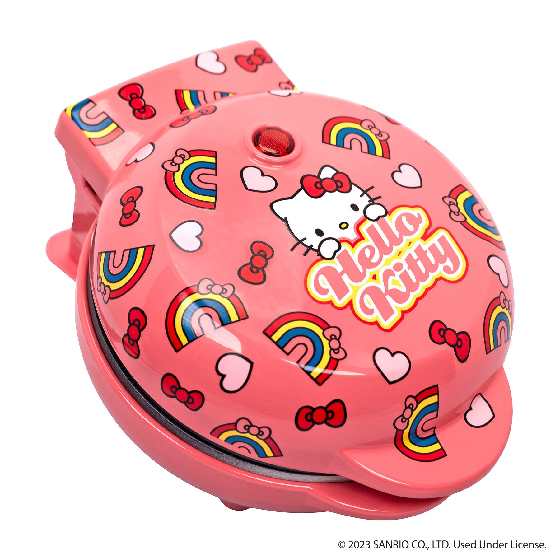 Top-down view of the hello kitty mini waffle iron with lid closed on a kitchen counter