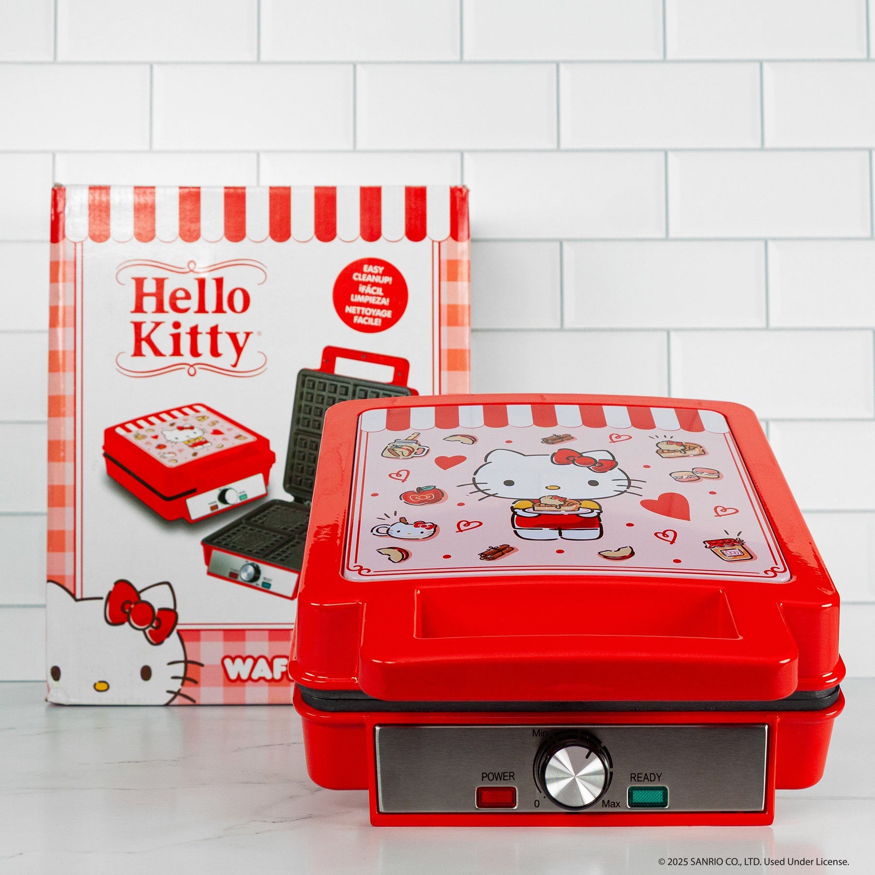 Hello Kitty themed waffle maker with red exterior and character details