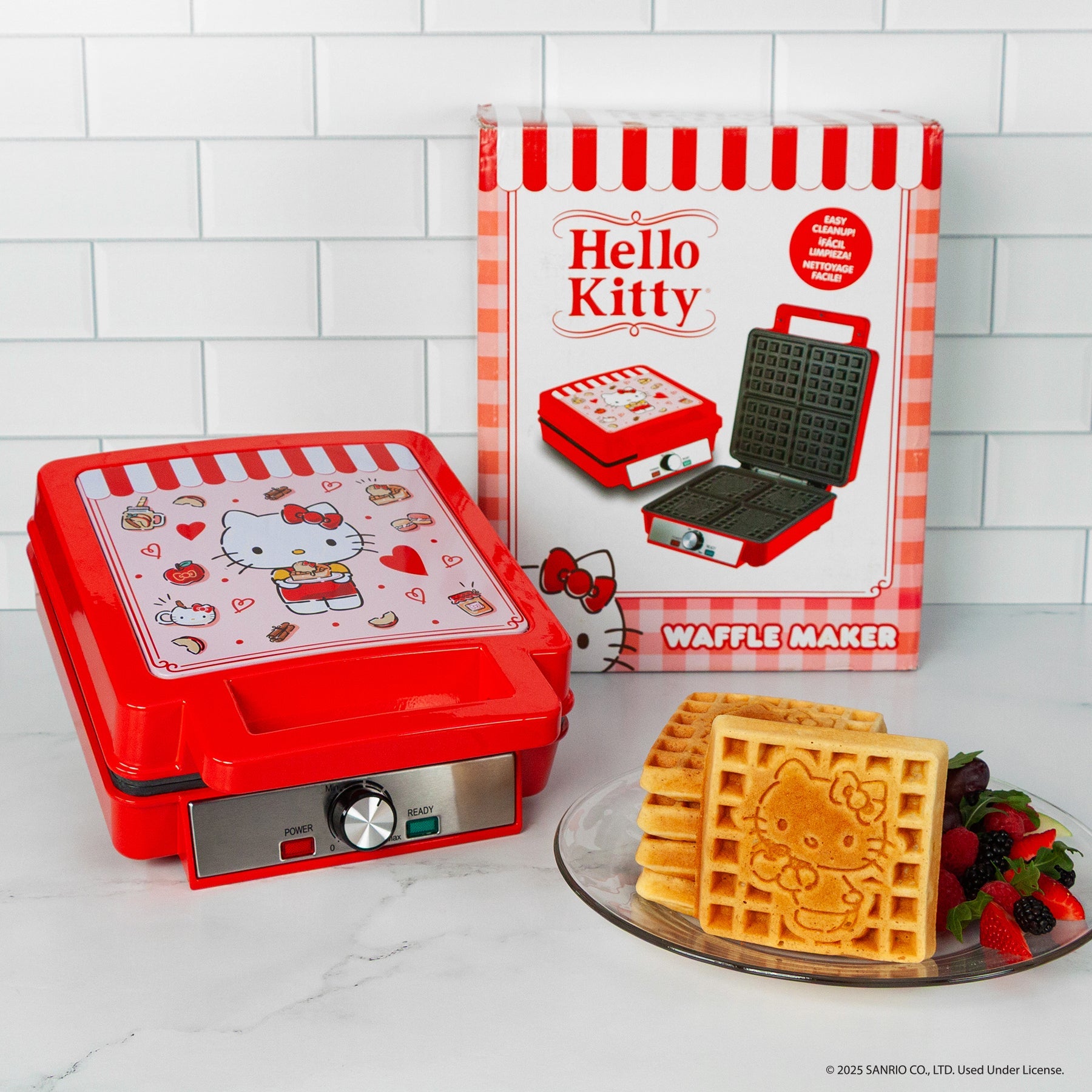 Waffles cooking in the non-stick plates of the Hello Kitty waffle maker
