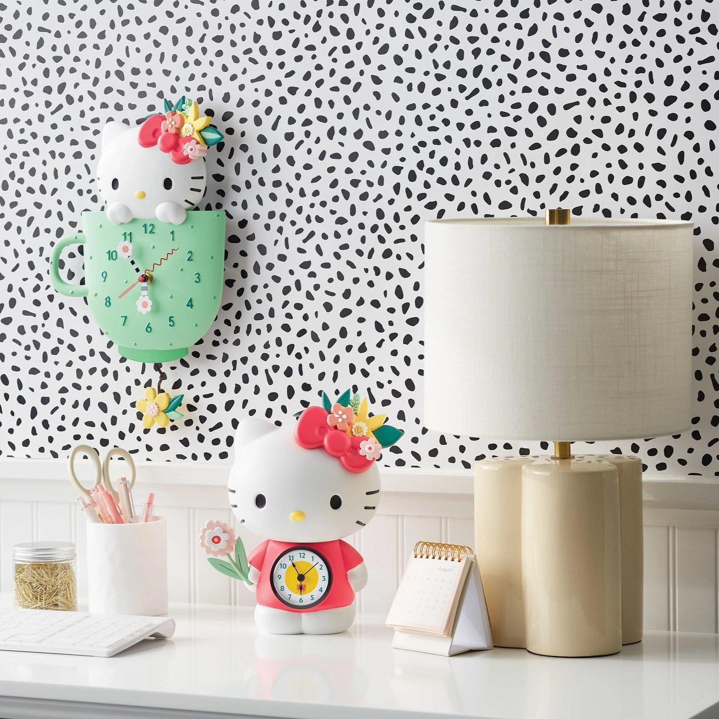 Hello Kitty clock details, highlighting the flower hands and pendulum