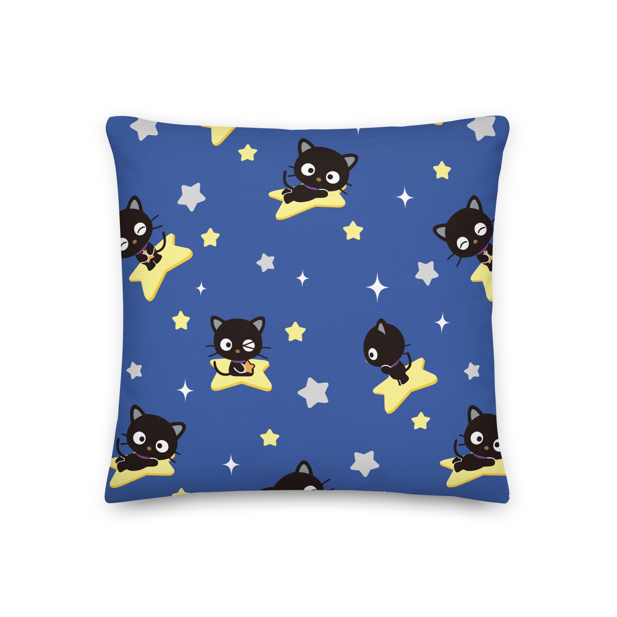 Chococat Starry Night decorative pillow on a bedroom bed, surrounded by other throw pillows