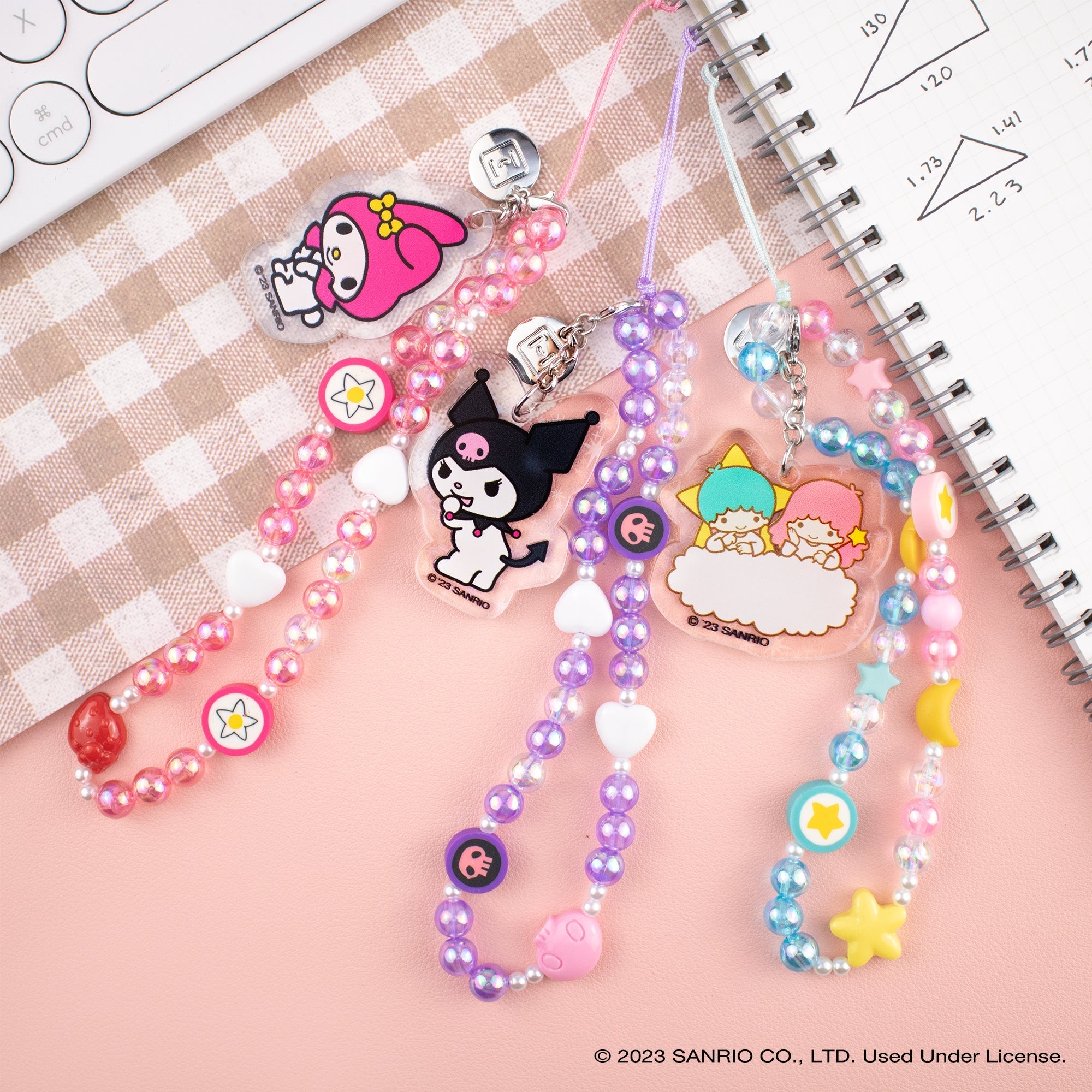 Close-up of the Cinnamoroll beaded phone wristlet with charm and wrist strap