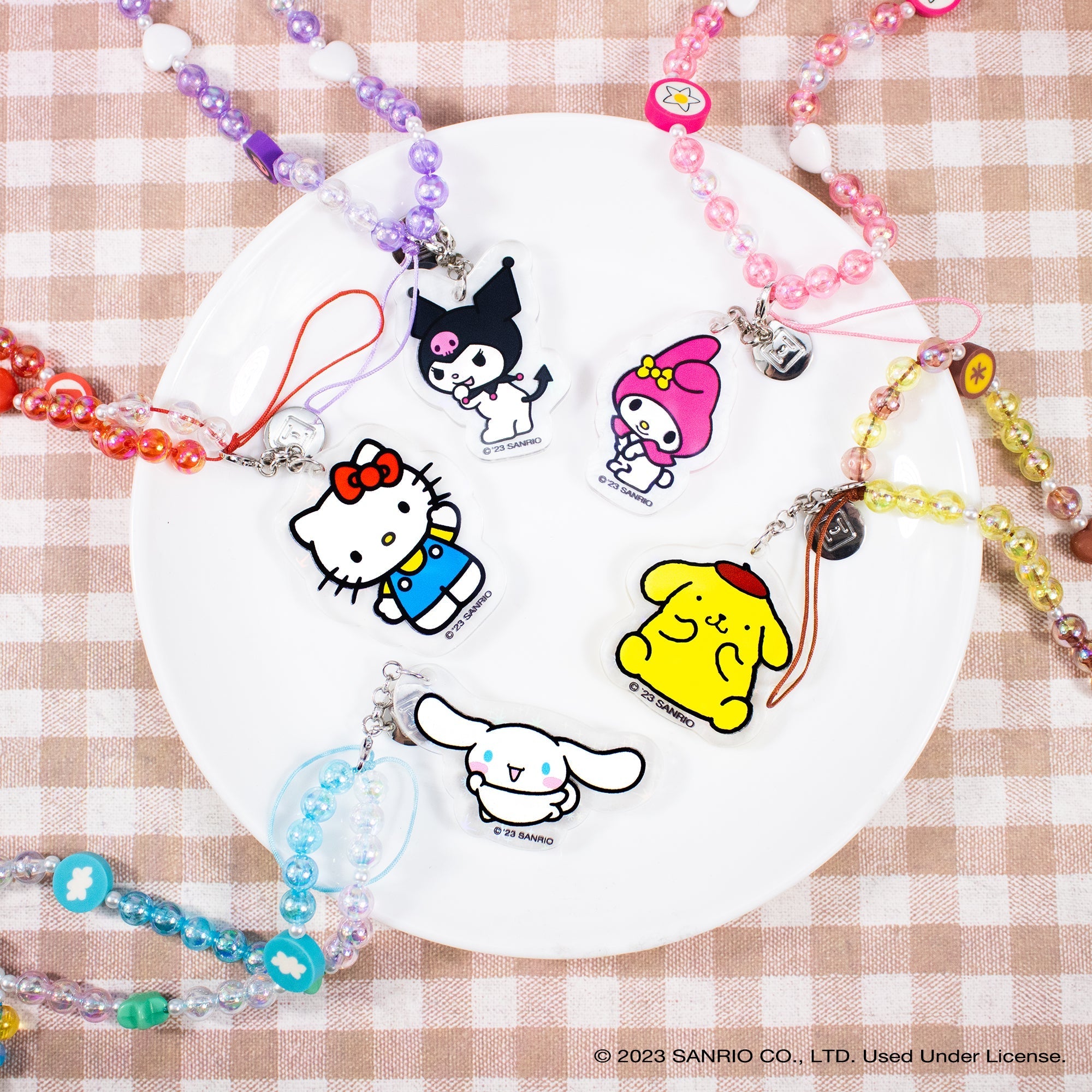 Detachable glitter charm featuring Cinnamoroll hanging from the wristlet