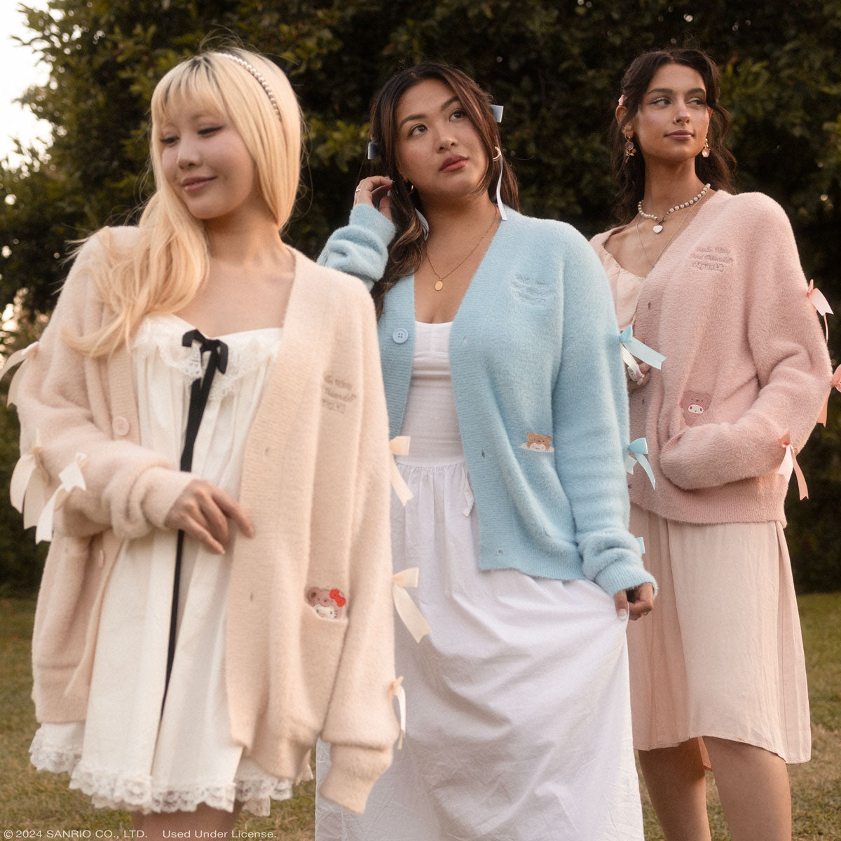 Model wearing the pink Cinnamoroll cardigan with satin bow details