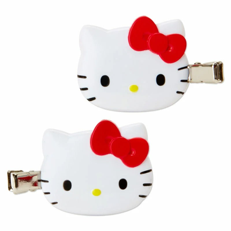 Hello Kitty mini hair clips in red being used to secure hair while applying makeup