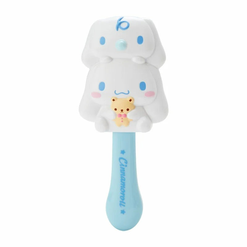 Close-up of Cinnamoroll hair brush showing signature handle and die-cut details