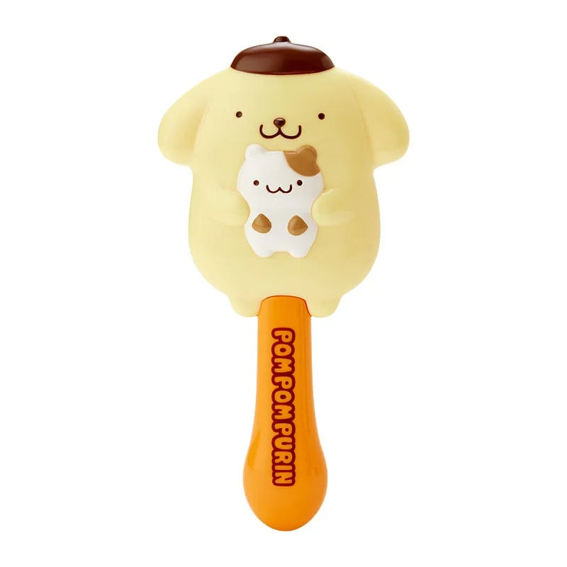 Close-up of the Pompompurin hair brush showing die-cut design