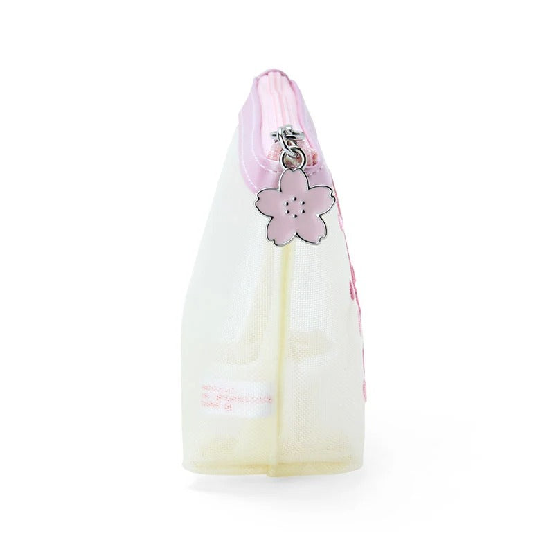 Close-up of Hello Kitty mesh pouch with embroidered floral details and zipper closure