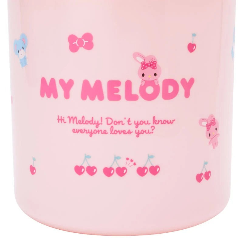 Close-up of the My Melody character trash container with swinging lid on a desk