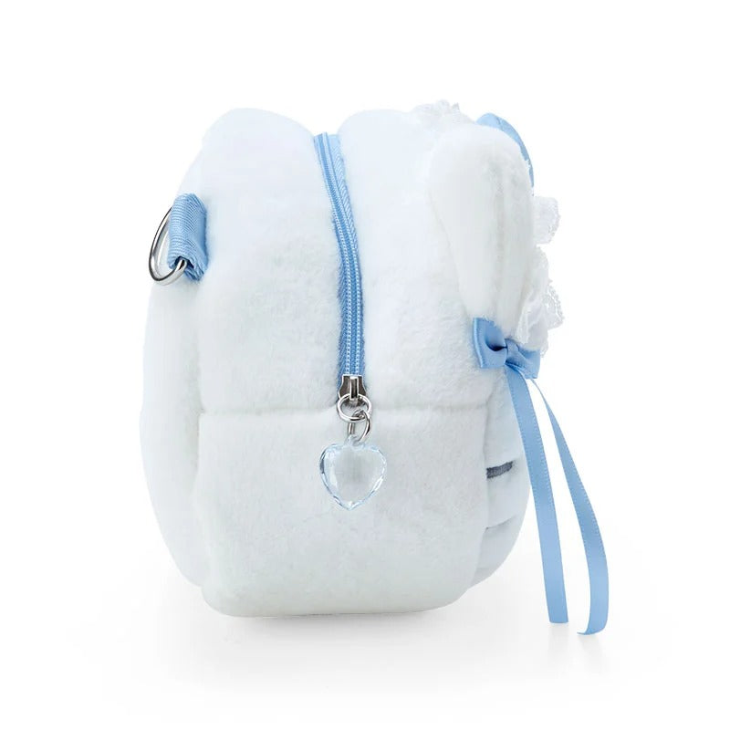 Close-up of the heart zipper charm and internal pocket of the plush bag.