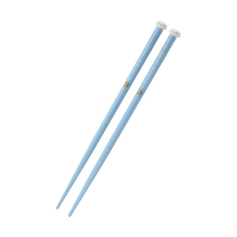 Close-up of Cinnamoroll chopsticks resting on pastel ceramic chopstick holders