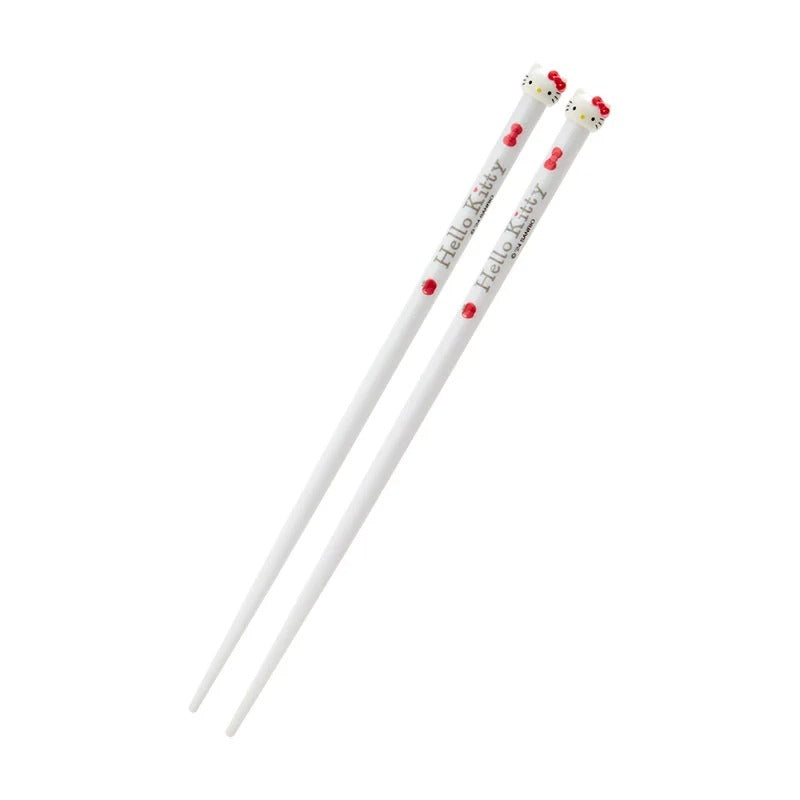 Close-up of Hello Kitty chopsticks showing the detailed design