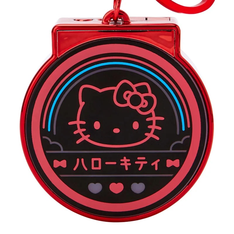 Side view of the keychain showing the ribbon charm and switch