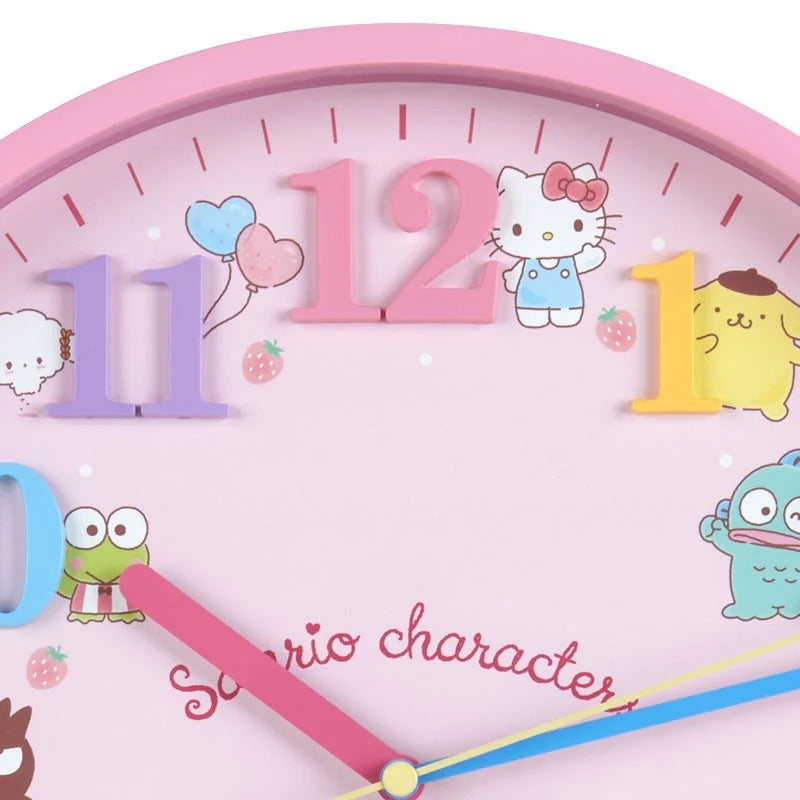 Close-up of Sanrio characters on a vibrant wall clock with strawberry background