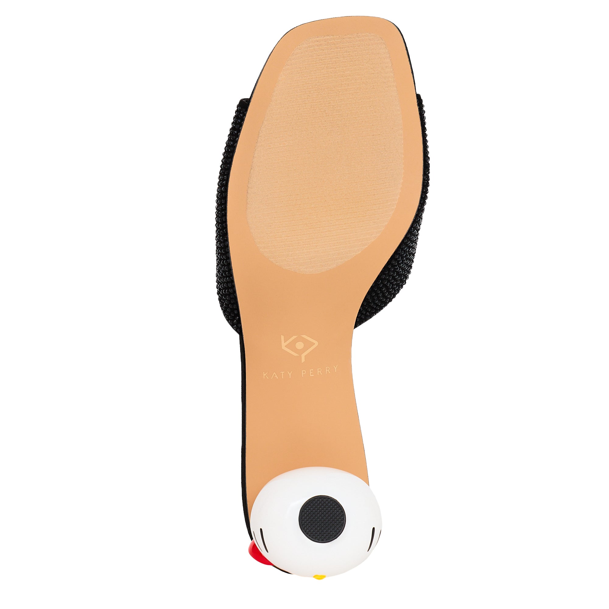 Front view of Hello Kitty x Katy Perry black mule sandals on wooden floor
