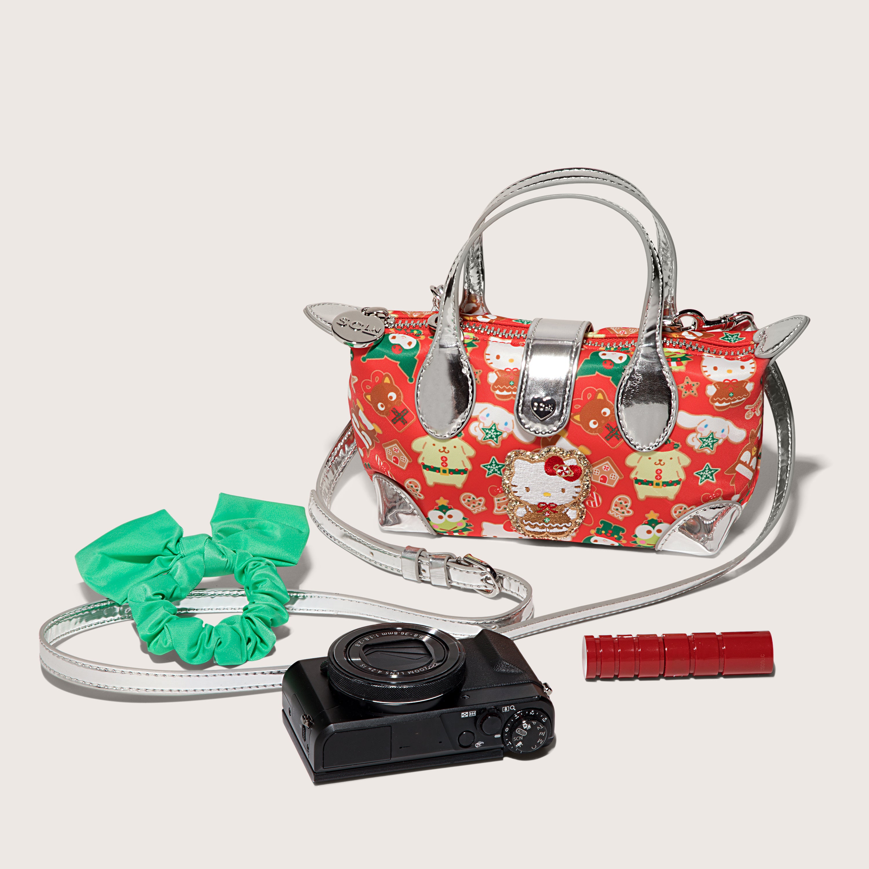 Close-up of the hello kitty makeup bag showing silver accents and zipper detail