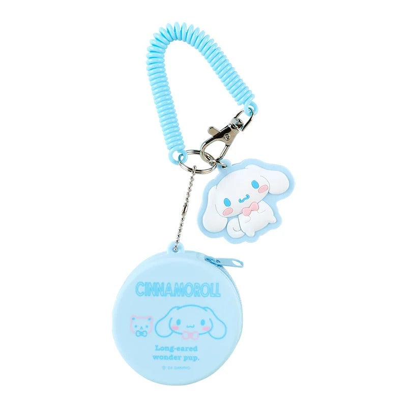 Front view of Cinnamoroll keychain attached to a floral tote, showing pouch detail.