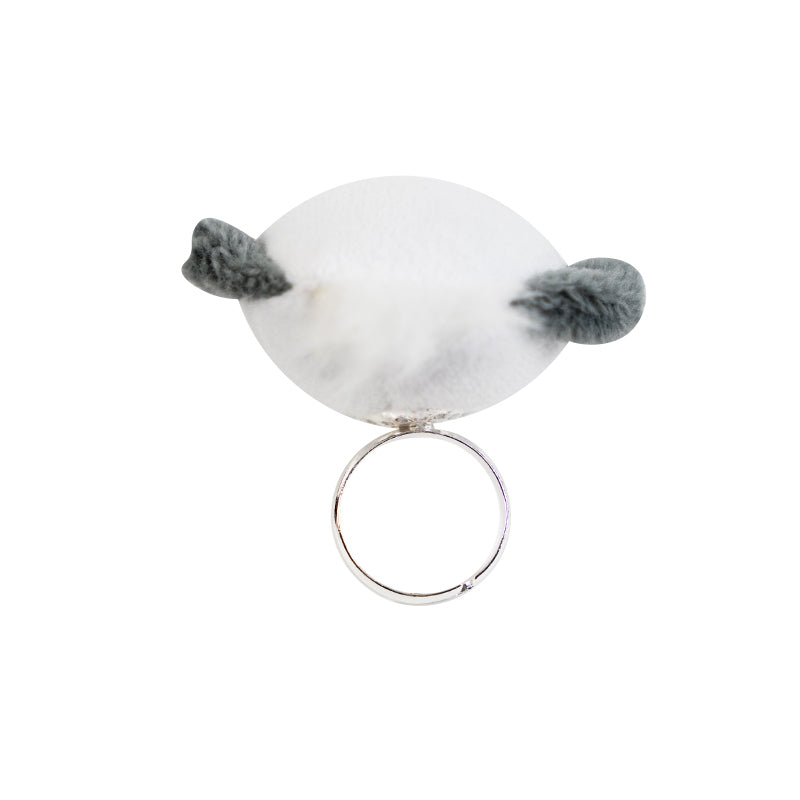 Pochacco ring worn on hand, styled with kawaii desk accessories in a pastel-themed workspace.