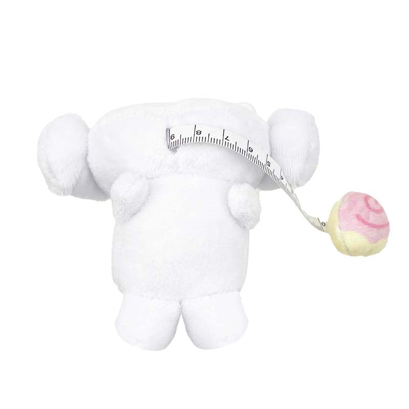 Using the Cinnamoroll plush measuring tape to measure a craft project